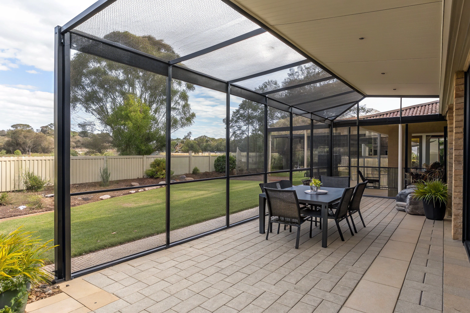 full-screened-patio-enclosure-with-mesh-panels-on-
