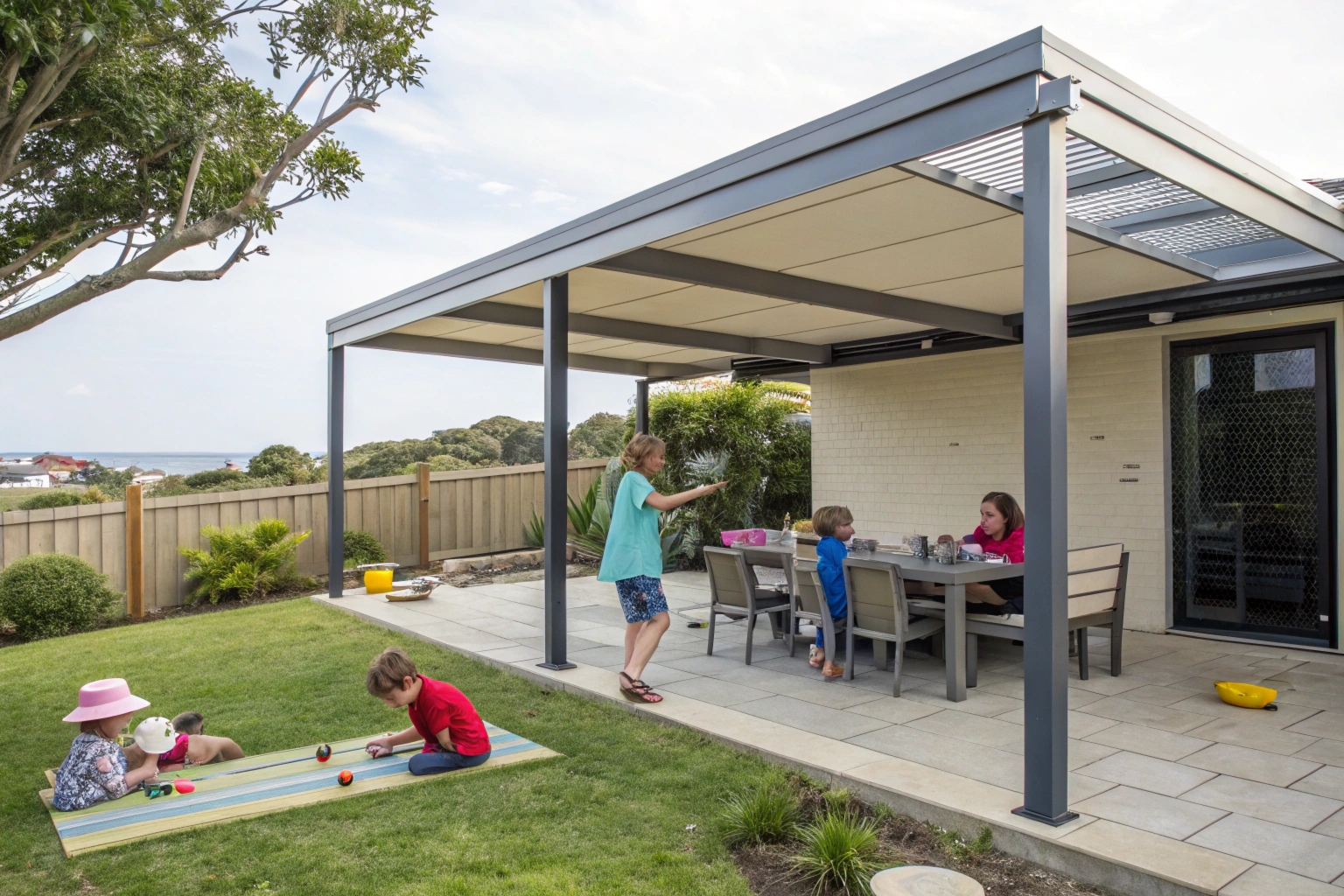 Family entertaining under a covered pergola in a Central Coast suburban backyard